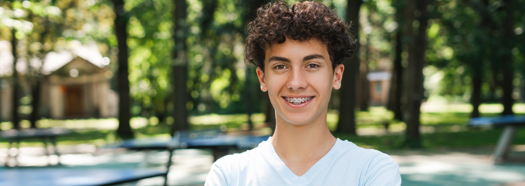 Young Man With Curly Hair Stands at Meadville Pennsylvania