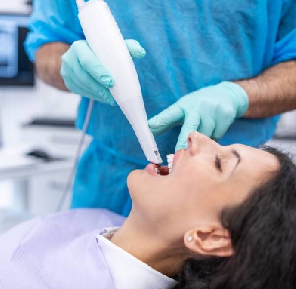 Woman Receiving a Dental Cleaning From a Dentist at Meadville Pennsylvania