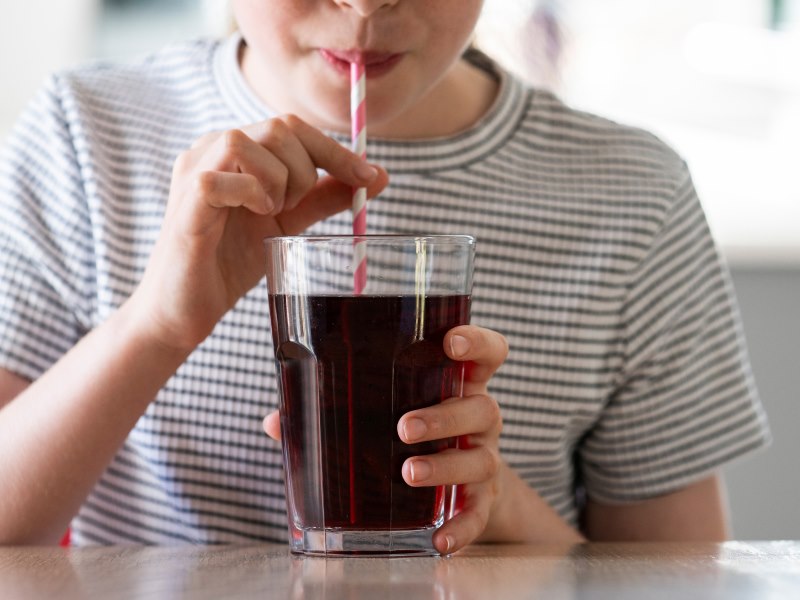 A Young Boy Enjoying A Refreshing Glass Of Soda at Meadville Pennsylvania